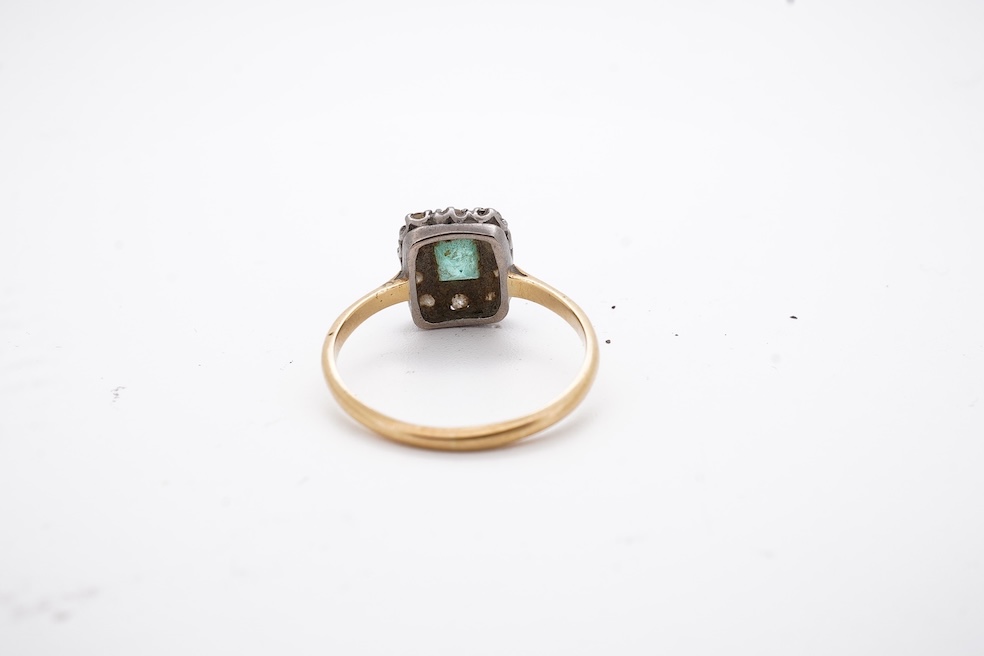An early to mid 20th century yellow metal, emerald and diamond set rectangular cluster ring, size R, gross weight 3.5 grams. Condition - poor to fair